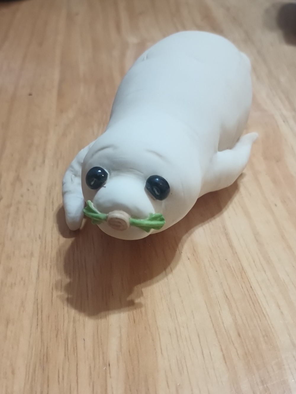 Enesco White Seal turnip style Figurine with Green Accent and Black Eyes